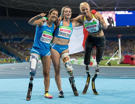 In this photo released by the IOC, Italy's Martina Caironi, center, celebrates after winning the Women's 100m - T42 Final ahead of Germany's Vanessa, right, and Italy's Monica Graziana Contrafatto, left, at the Olympic Stadium during the Paralympic Games in Rio de Janeiro, Brazil, Saturday, Sept. 17, 2016. (Al Tielemans/OIS, IOC via AP) [CopyrightNotice: Olympic Information Services OIS. This image is offered for editorial use only by the IOC. Commercial use is prohibited.]